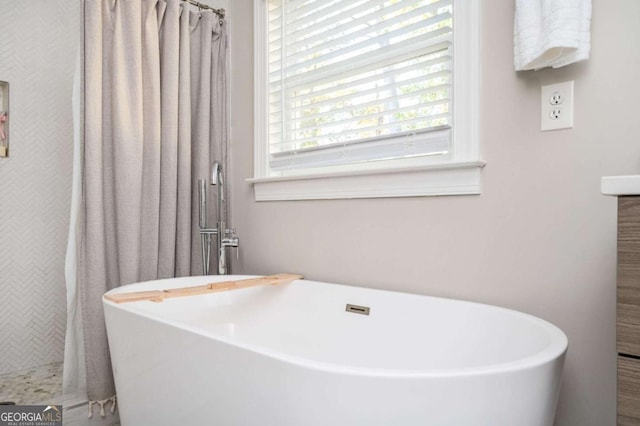 963 Turner Dr SE, Smyrna, GA 30080 - full bathroom with tiled shower and a freestanding tub