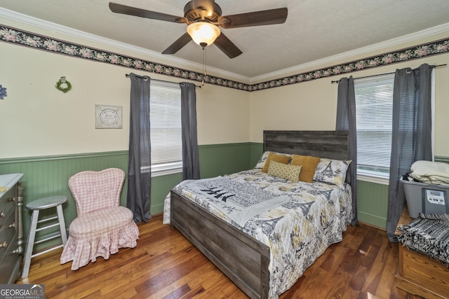 303 Cherokee St, Pine Mountain, GA 31822 - bedroom featuring wainscoting, hardwood / wood-style flooring, ornamental molding, and ceiling fan
