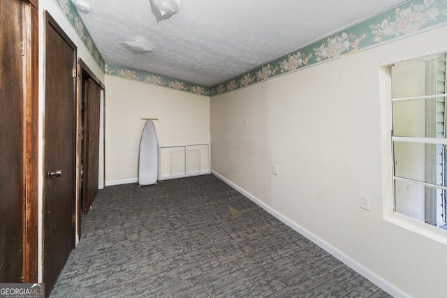 303 Cherokee St, Pine Mountain, GA 31822 - carpeted spare room featuring baseboards and a textured ceiling