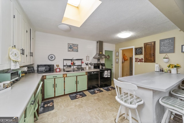 303 Cherokee St, Pine Mountain, GA 31822 - kitchen with wall chimney exhaust hood, black appliances, green cabinetry, a kitchen bar, and a peninsula
