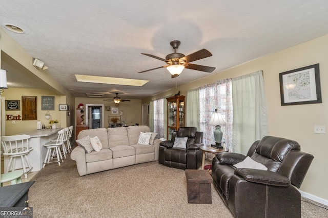 303 Cherokee St, Pine Mountain, GA 31822 - carpeted living room featuring a ceiling fan and a skylight