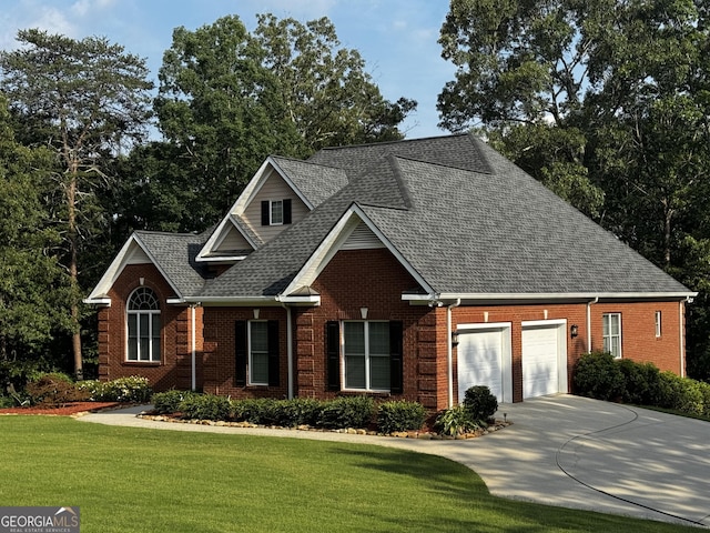 131 Winesap Way, Clarkesville, GA 30523 - traditional-style house with brick siding, roof with shingles, an attached garage, driveway, and a front lawn
