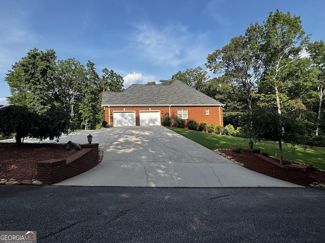 131 Winesap Way, Clarkesville, GA 30523 - view of front of house with a garage, a front yard, concrete driveway, and brick siding