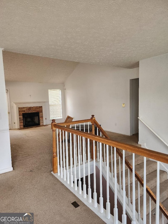 3059 Brass Dr, Austell, GA 30106 - hall with carpet, a textured ceiling, and an upstairs landing