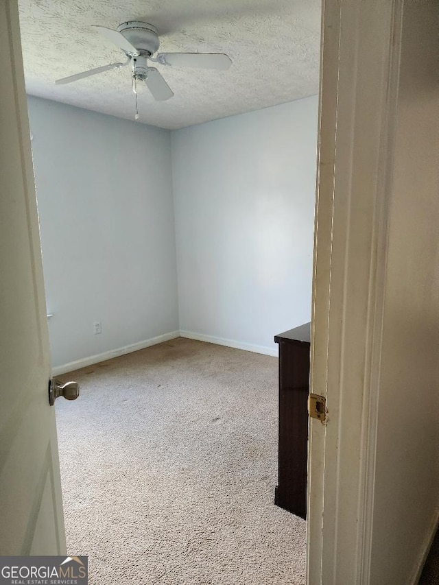3059 Brass Dr, Austell, GA 30106 - spare room with ceiling fan, carpet flooring, and a textured ceiling