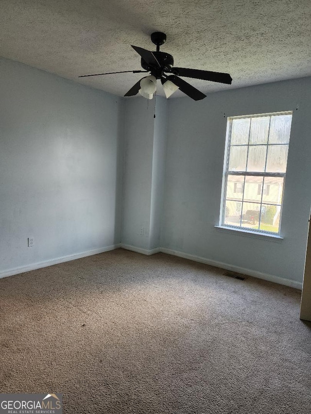 3059 Brass Dr, Austell, GA 30106 - spare room with carpet flooring, a textured ceiling, and ceiling fan