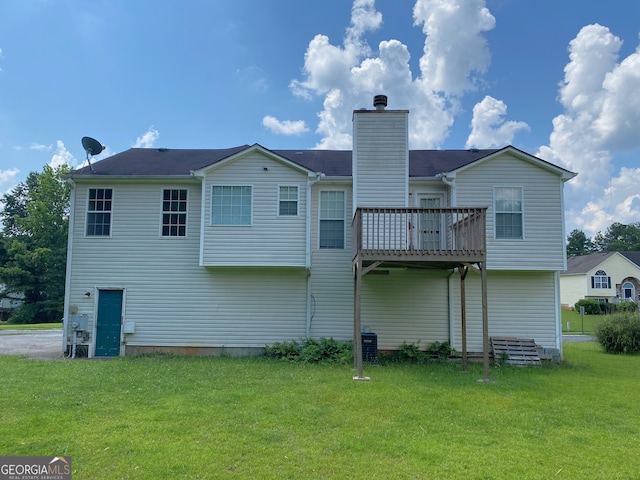 3059 Brass Dr, Austell, GA 30106 - back of property with a lawn, a chimney, and a wooden deck