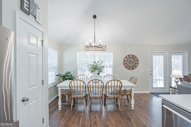 231 Brookstone Ct, Rincon, GA 31326 - dining area with dark wood-style floors, a chandelier, lofted ceiling, and a textured ceiling