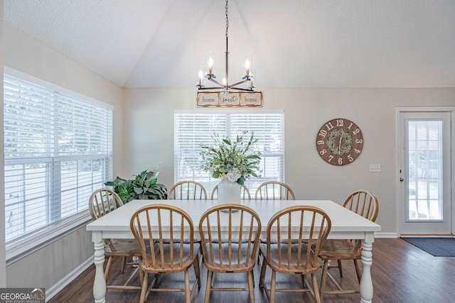 231 Brookstone Ct, Rincon, GA 31326 - dining space featuring a chandelier, dark wood-style floors, plenty of natural light, and lofted ceiling