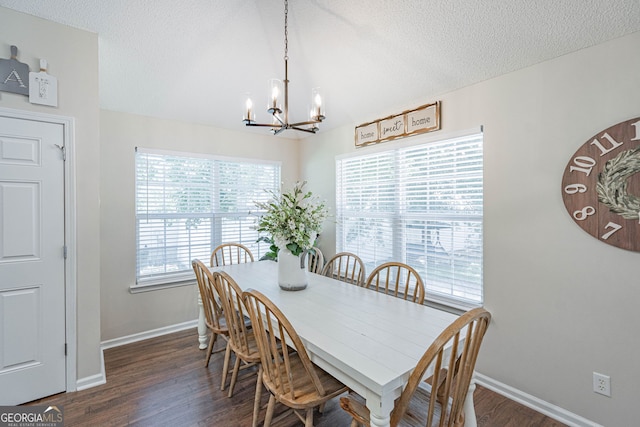 231 Brookstone Ct, Rincon, GA 31326 - dining space featuring a chandelier, dark wood finished floors, and a textured ceiling