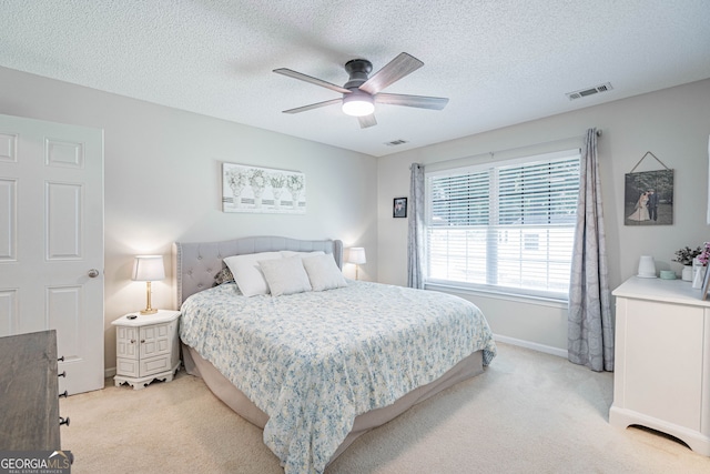 231 Brookstone Ct, Rincon, GA 31326 - bedroom featuring light colored carpet, a textured ceiling, and ceiling fan