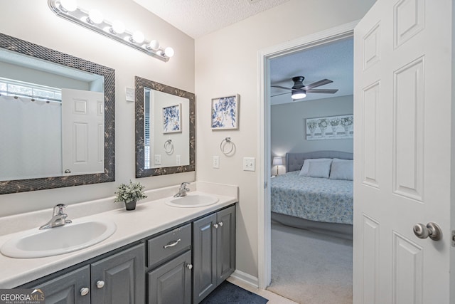 231 Brookstone Ct, Rincon, GA 31326 - bathroom featuring ensuite bath, double vanity, a textured ceiling, and ceiling fan