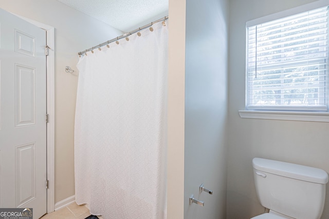 231 Brookstone Ct, Rincon, GA 31326 - bathroom with a textured ceiling, tile patterned floors, and a shower with shower curtain