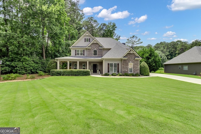 14 Hammock Ridge Dr, Newnan, GA 30265 - craftsman inspired home featuring a front lawn, a porch, stone siding, and roof with shingles