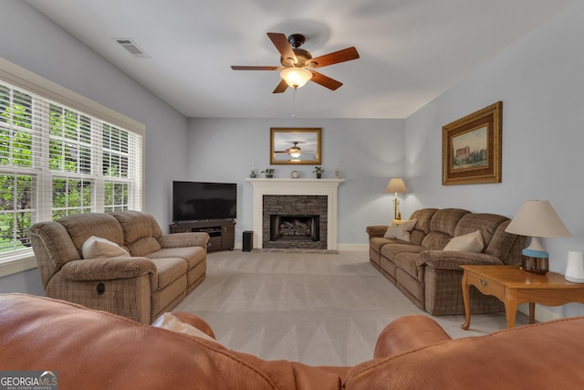 14 Hammock Ridge Dr, Newnan, GA 30265 - living room with light carpet, ceiling fan, and a stone fireplace