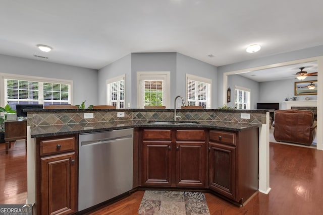14 Hammock Ridge Dr, Newnan, GA 30265 - kitchen with stainless steel dishwasher, open floor plan, plenty of natural light, and dark wood-style flooring