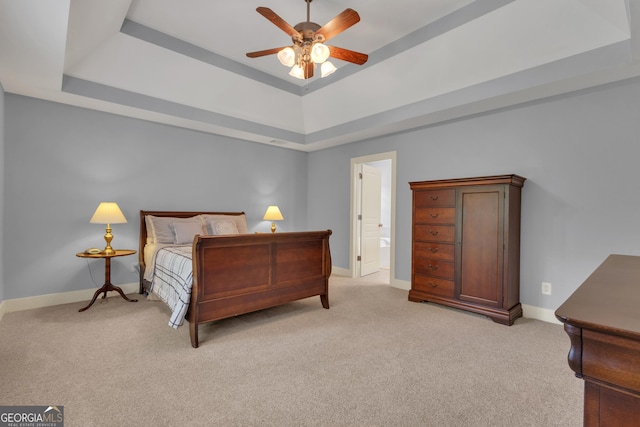 14 Hammock Ridge Dr, Newnan, GA 30265 - bedroom with a raised ceiling, light colored carpet, a ceiling fan, and ensuite bathroom