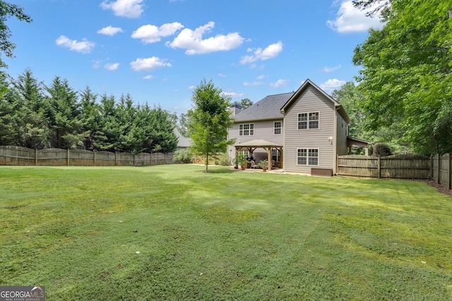 14 Hammock Ridge Dr, Newnan, GA 30265 - back of property with a gazebo, a fenced backyard, and a patio