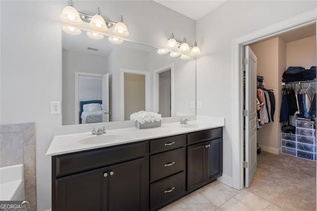 5504 Cameron Parc Dr, Johns Creek, GA 30022 - ensuite bathroom featuring double vanity, a garden tub, and a spacious closet