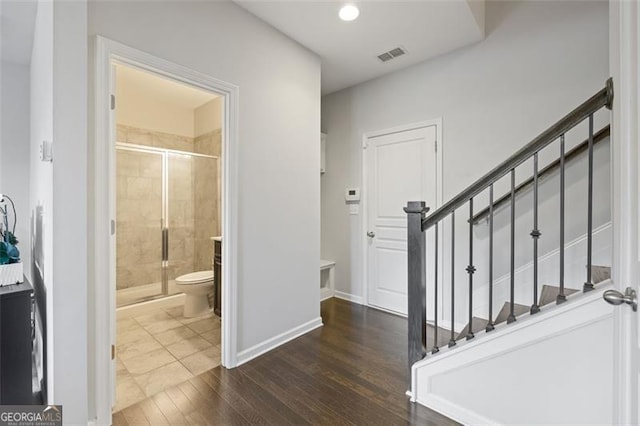 5504 Cameron Parc Dr, Johns Creek, GA 30022 - hallway featuring dark wood-type flooring and stairway
