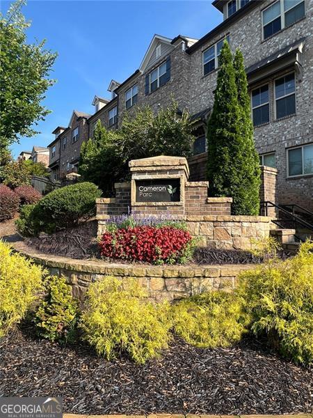 5504 Cameron Parc Dr, Johns Creek, GA 30022 - community sign with a residential view