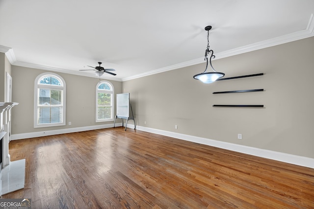 6459 Chariot St Unit 35, Atlanta, GA 30328 - unfurnished living room featuring crown molding, a ceiling fan, and wood finished floors