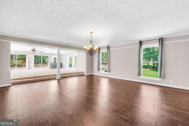234 Crumbley Rd, Mcdonough, GA 30252 - unfurnished living room featuring a chandelier, a textured ceiling, dark wood-style floors, crown molding, and a ceiling fan