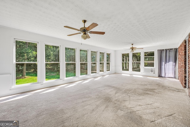 234 Crumbley Rd, Mcdonough, GA 30252 - unfurnished sunroom featuring a textured ceiling, carpet flooring, and cooling unit