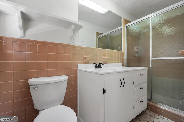 234 Crumbley Rd, Mcdonough, GA 30252 - full bathroom with tile walls, vanity, and a stall shower