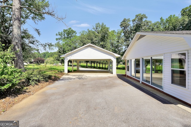 234 Crumbley Rd, Mcdonough, GA 30252 - view of patio / terrace with a carport and asphalt driveway