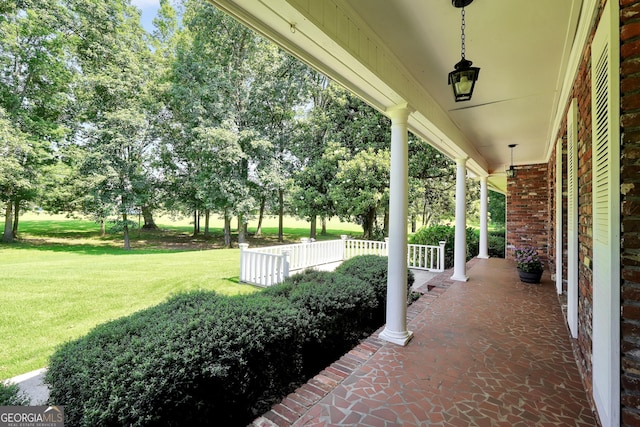 234 Crumbley Rd, Mcdonough, GA 30252 - porch featuring a lawn and view of wooded area