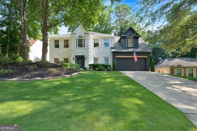 4385 Pinehollow Ct, Alpharetta, GA 30022 - view of front of property with concrete driveway, a front yard, stone siding, and a garage