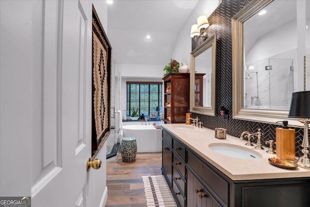 4385 Pinehollow Ct, Alpharetta, GA 30022 - bathroom with a freestanding tub, a shower stall, double vanity, wood finished floors, and recessed lighting