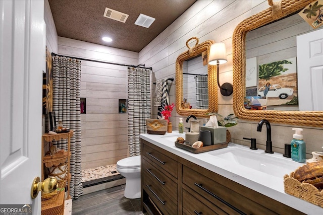 4385 Pinehollow Ct, Alpharetta, GA 30022 - bathroom with vanity, a stall shower, wood walls, wood finished floors, and decorative backsplash
