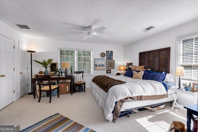 4385 Pinehollow Ct, Alpharetta, GA 30022 - carpeted bedroom with multiple windows, a desk, a textured ceiling, and ceiling fan