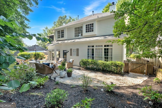 4385 Pinehollow Ct, Alpharetta, GA 30022 - rear view of house featuring a chimney, a patio, an outdoor hangout area, and a shingled roof