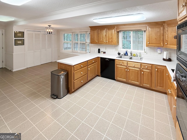 180 Broomsedge Trl, Athens, GA 30605 - kitchen featuring black appliances, a textured ceiling, tasteful backsplash, a peninsula, and light countertops