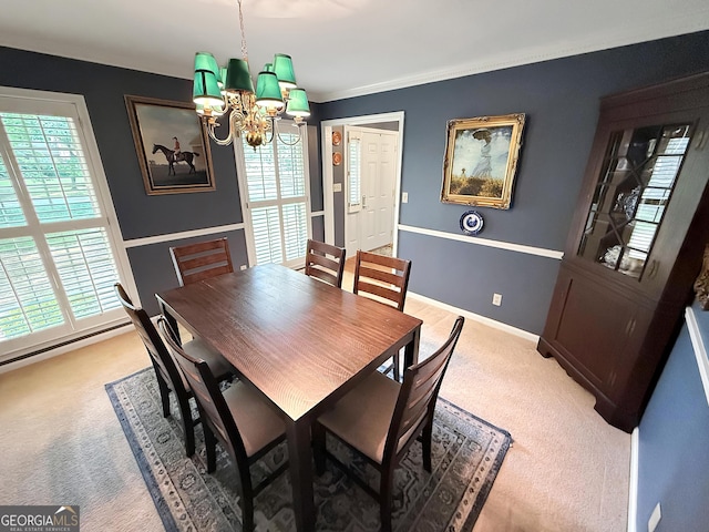 180 Broomsedge Trl, Athens, GA 30605 - dining space featuring light carpet, a chandelier, plenty of natural light, ornamental molding, and a baseboard radiator