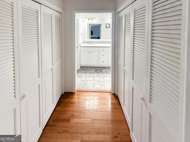 180 Broomsedge Trl, Athens, GA 30605 - hallway with light wood-style floors and a sink