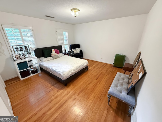 180 Broomsedge Trl, Athens, GA 30605 - bedroom featuring light wood-style floors and multiple windows