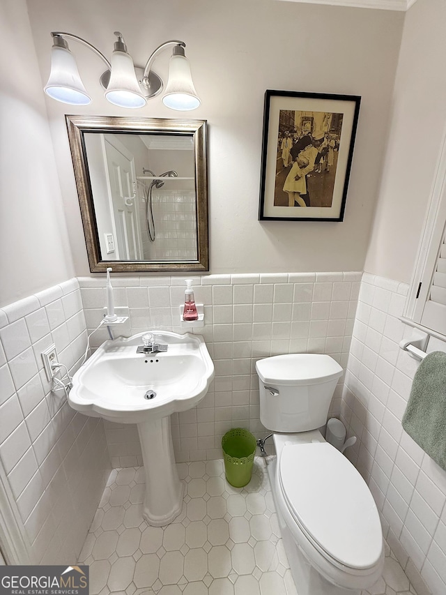 180 Broomsedge Trl, Athens, GA 30605 - full bathroom featuring tile walls, a shower, a wainscoted wall, and tile patterned floors
