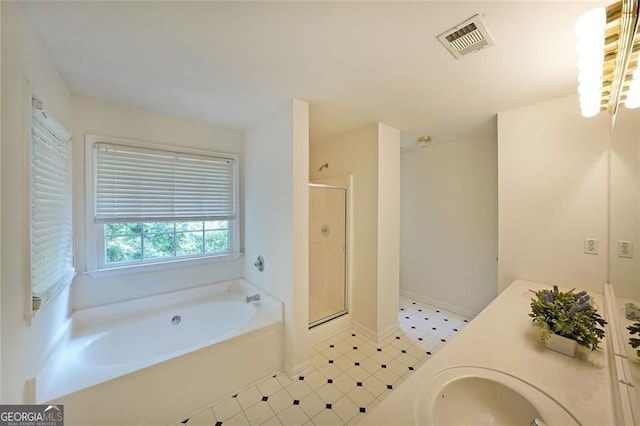 5176 Shotwell St, Woodstock, GA 30188 - full bathroom with a garden tub, a stall shower, vanity, and tile patterned floors