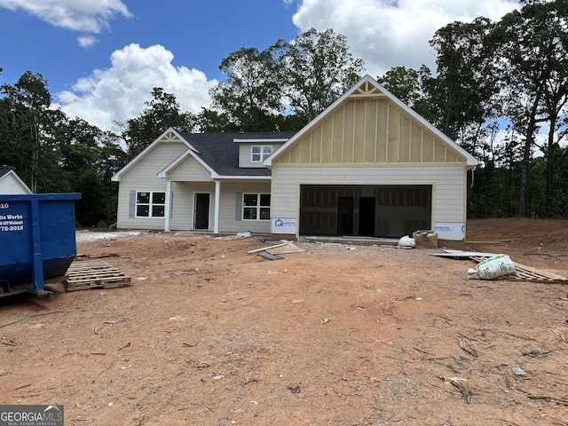 32 Sourwood Dr, Mansfield, GA 30055 - property under construction featuring an attached garage, board and batten siding, and driveway