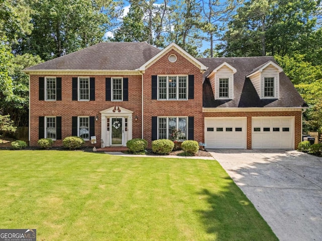 4961 Thornwood Trce NW, Acworth, GA 30102 - view of front of house featuring driveway, a front yard, brick siding, a garage, and roof with shingles
