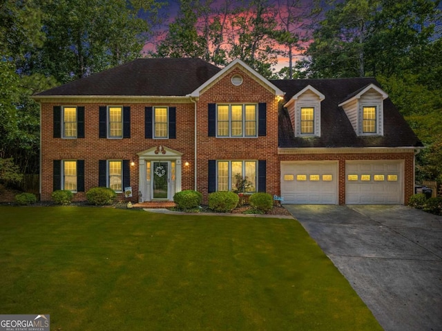 4961 Thornwood Trce NW, Acworth, GA 30102 - georgian-style home featuring driveway, a front yard, and brick siding