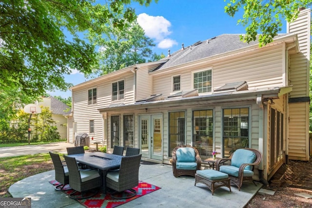 4961 Thornwood Trce NW, Acworth, GA 30102 - back of house featuring french doors, a patio area, and outdoor dining space