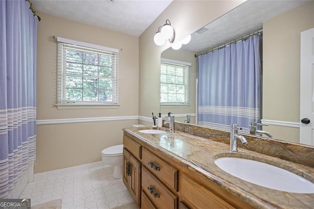 7045 Hunters Knl NE, Sandy Springs, GA 30328 - full bath featuring double vanity and a textured ceiling