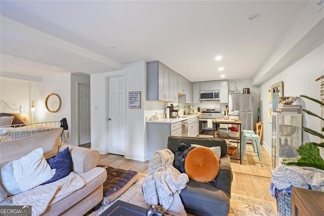 7045 Hunters Knl NE, Sandy Springs, GA 30328 - living area with light wood-style floors and recessed lighting