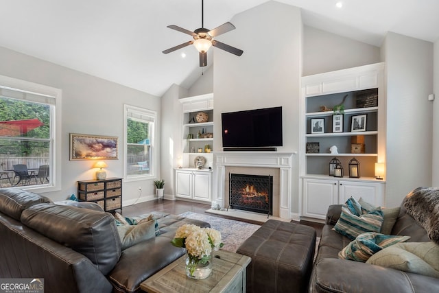 6430 Banbury Ct SE, Mableton, GA 30126 - living room with ceiling fan, dark wood finished floors, a lit fireplace, high vaulted ceiling, and recessed lighting