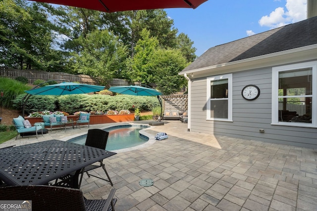 6430 Banbury Ct SE, Mableton, GA 30126 - fenced backyard featuring a patio, an outdoor living space, a hot tub, and outdoor dining area